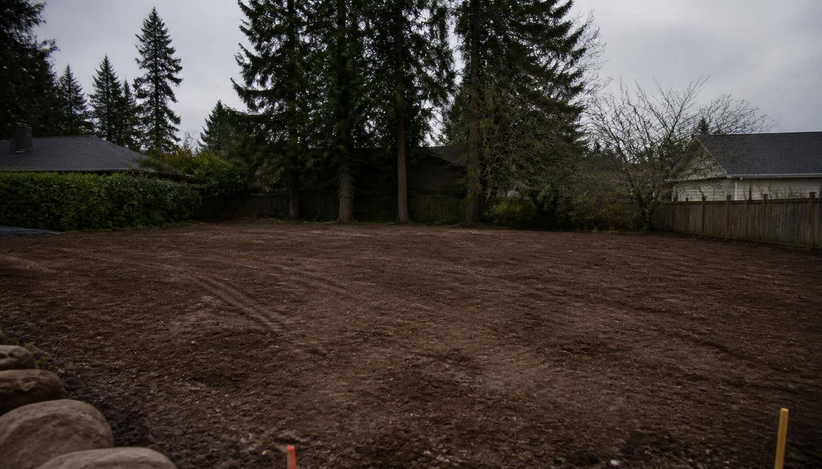 Cleared, graded lot after demolition